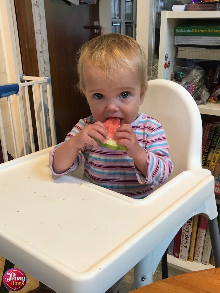 September - Tube Stop Baby eating watermelon in her high chair